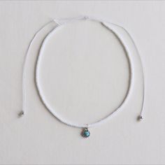 Never have to worry about your necklace rusting or tarnishing again with our WaveBoxx original 100% Waterproof choker necklace! It is made with a durable wax cord that will not fade or lose color! For a clasp, there is an adjustable knot eliminated any rusting materials as while as allows for the necklace to be easily put on and taken off! Our chokers are perfect for all active lifestyles! Perfect for Saturday morning yoga, Kayaking down the river or calling at the beach! + Details : - Adjustabl White Adjustable Nylon Cord Jewelry, Casual White Jewelry With Nylon Cord, White Necklace With Adjustable Waxed Cord, White Jewelry With Adjustable Cord For Festivals, Adjustable Silver Choker With Colorful Beads, Silver Adjustable Choker With Colorful Beads, Silver Choker With Colorful Beads, Adjustable, White Adjustable Casual Choker, White Casual Adjustable Choker