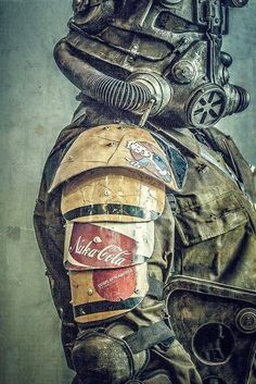 a man wearing a gas mask and holding a can of coca cola in his hand