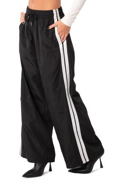 Sporty stripes trail the sides of these wide-leg track pants topped with a comfortable elastic waist. 100% polyester Machine wash, tumble dry Imported Nylon Track Pants, Cool Women, Sporty Pants, Perfect White Tee, Adidas Track Pants, Adidas Track, Jogging Pants, Nylon Fabric, Side Stripe