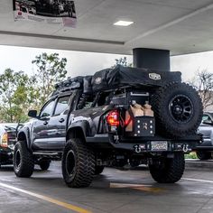 the truck is loaded with items and ready to go into the gas station for its next trip