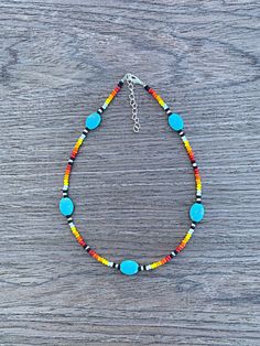 This Cowgirl Sunset Necklace brings a unique charm to any outfit. Crafted with serape and beaded materials, it's 17" long and comes with an extender for added versatility. It's the perfect statement piece to help you make a lasting impression. ( Disclaimer: All items are uniquely crafted and created by GenZCreations. Our Items are NOT AUTHENTIC American Indian or Alaska Native American nor do they represent any Indian Tribe) Seed Bead Necklace Ideas Western, Beaded Southwestern Turquoise Necklace, Adjustable Beaded Southwestern Turquoise Necklace, Multicolor Beaded Turquoise Necklace For Festivals, Adjustable Turquoise Necklace With Colorful Beads For Festival, Southwestern Multicolor Beaded Chain Jewelry, Southwestern Multicolor Beaded Jewelry, Southwestern Style Multicolor Beaded Chain Jewelry, Multicolor Southwestern Beaded Chain Jewelry