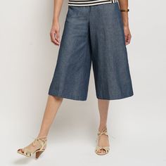 Our denim culottes are a study in proportion: they sit high on the natural waistline, fall below the knees, and have the most flattering wide legs. With every wash and wear, the dark denim will soften more and more. Extra credit goes towards the slant pockets and flat-front waistband with elastic back. Relaxed Fit Medium Wash Wide Leg Pants For Work, Spring Cotton Cropped Leg Culottes, Spring Cotton Culottes With Cropped Leg, Mid-rise Wide Leg Pants For Summer, Versatile Medium Wash Bottoms For Day Out, Modern Cropped Leg Bottoms For Spring, Wide-leg Cotton Capris For Work, Dark Wash Relaxed Fit Bottoms For Business Casual, Business Casual Dark Wash Relaxed Bottoms