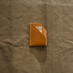 Rugged wallet hand-crafted from vegetable tanned leather. Hand-stitched construction with beeswax-coated linen thread. This wallet will withstand the daily grind—day in, day out. ─ Add your initials to denote ownership of your wallet explore our Bespoke Monogram Service guide. Linen Thread, Daily Grind, Pocket Wallet, Vegetable Tanned Leather, Hand Stitched, Tan Leather, Bespoke, Initials, Hand Crafted