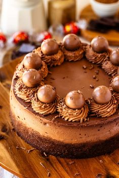 a chocolate cake sitting on top of a wooden cutting board