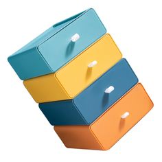 four different colored drawers stacked on top of each other