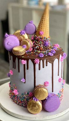 there is a cake decorated with ice cream and sprinkles