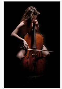 a woman with long hair playing the cello