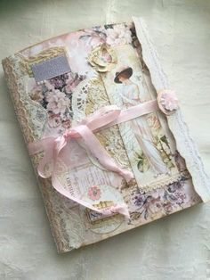 an old book covered in paper and ribbon