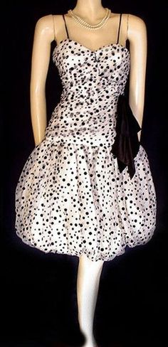 EASY LAYAWAY IS AVAILABLE Original Price $189.99 AN ADORABLE VINTAGE BUBBLE BALLOON DRESS IN BLACK & WHITE WITH VELVET FLOCKED DOTS BY NANCY BRACCOLONI FOR BRACCOLONI THE TULLE SWEETHEART BODICE IS RUCHED & DRAPED FOR A HUGE LOOKING BUSTLINE WITH BLACK VELVET FLOCKED DOTS - THERE ARE TINY STRAPS WHICH COULD BE TUCKED INSIDE IF YOU WANTED A STRAPLESS LOOK BIG FABRIC HEAVY SATIN BOW ON THE SIDE - BIG PUFFY FULL SKIRT IS LINED WITH A SILKY FABRIC WITH A CRINOLINE INSIDE FOR FULLNESS & I Vintage 60s Dress, Vintage Dress 60s, Balloon Dress, Lace Nightgown, Silky Fabric, 60s Dress, Satin Bow, Sweetheart Neck, Dot Dress