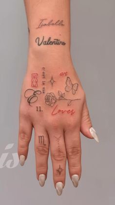 a woman's hand with tattoos on it and the word valentine written in cursive writing