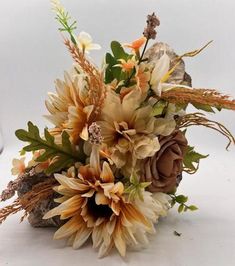 a bouquet of flowers sitting on top of a table