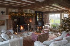 a living room filled with furniture and a fire place