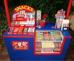 a snack stand with snacks and candy on it