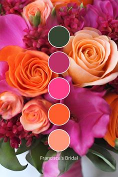 an arrangement of flowers with shades of pink and orange