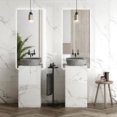 two bathroom sinks sitting next to each other on top of a wooden floor in front of a mirror