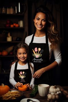 a mother and daughter preparing food in the kitchen