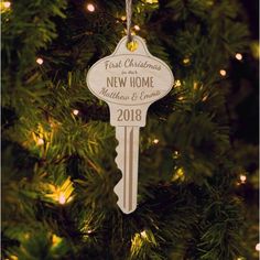 a wooden key ornament hanging from a christmas tree