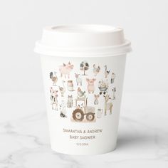 a white cup with animals on it