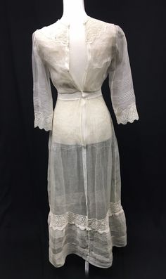 "Absolutely beautiful 1910s Edwardian Silk Organza Day Dress for a Petite young lady - Crew neck and cuffs trimmed in Venise machine lace - Front decorated with crochet covered buttons (non functional) - Pin tucks down bodice front and back - Sleeves and other vertical seams are finished with open work - Combination of hand work and machine stitching - Closes in the back with 4 hook and eyes and 1 set of snaps (added later) - Bottom of skirt is also detailed with pin tucks, machine lace and open Historical Long Sleeve Daywear Dress, Historical Long Sleeve Day Dress, Cream Victorian Vintage Dress For Daywear, Historical Long-sleeve Day Dress, Historical Long Sleeve Dresses For Daywear, Classic Lined Vintage Dress For Daywear, Classic Vintage Dress For Daywear, Lined, Long Sleeve Dresses With Historical Design For Daywear, Historical Design Long Sleeve Dress For Daywear