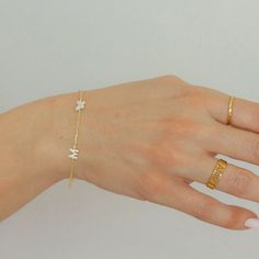 "Butterfly and Letter Bracelet!  Dainty, chic, and compliments any style! Each piece is handmade and crafted in our atelier just for you!  Made from 925 Sterling Silver with options of 14K Gold and Rose Gold Vermeil. Feel free to message me with any questions or for more details! We love hearing from you! :)  Jewelry pouch included with purchase. At Evva's handmade shop we know you'll find something lovely for yourself or to give as a gift to someone special! CURRENT PRODUCTION TIMES All items are handmade and made to order so please check our policies page for the most up to date production and delivery times. If you need it sooner, please send us a message on Etsy, we can prepare your item as fast as possible for your needed date. PACKAGING - If certain pieces are intended as gifts, plea Minimalist Monogram Bracelet For Everyday, Adjustable Monogram Name Bracelet, Minimalist Letter Beads Jewelry, Adjustable Initials Name Bracelet, Mother's Day Name Bracelet With Initials, Mother's Day Initials Name Bracelet, Minimalist Bracelets With Letter Beads, Dainty Adjustable Name Bracelet With Initials, Dainty Bracelets With Initials For Personalized Gifts