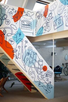 an artistic stair case with drawings on it