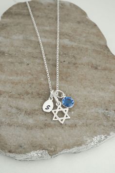 This tiny Star of David necklace is made of 925 sterling silver. We recommend our curb or snake chain for males. The necklace includes: - small Star of David charm (13 x 11 mm | approx 1/2 inch) - handstamped Initial charm  - Preciosa birthstone charm - anchor, snake, rope or curb chain (16 to 36 inches) ADD INITIAL CHARMS: https://etsy.me/3gMPv4r ADD BIRTHSTONE CHARMS: https://etsy.me/3gGTLT4 ADD BIRTHSTONE BEAD CHARMS: https://etsy.me/3gGltzv SILVER POLISHING CLOTH: https://etsy.me/3ieXQyh Loo Jewish Star Necklace, Jewish Star, Jewish Jewelry, Symbol Necklace, Chit Chat, Tiny Star, Jewelry Personalized, Jewelry Card, Birthstone Charms