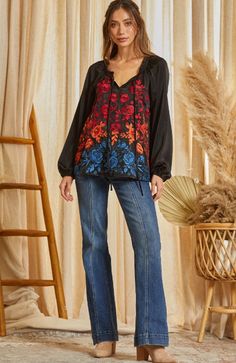 This floral embroidery tunic top features a balloon sleeve, ruffle details on the neckline, and a tie neck. Non sheer Fall V-neck Blouse With Embroidered Sleeves, Spring Embroidered Long Sleeve Top With Ruffles, Chic Spring Top With Embroidered Neckline, Chic Top With Embroidered Neckline For Spring, Chic Floral Embroidered Top For Fall, Chic Floral Embroidery Tops For Fall, Chic Long Sleeve Embroidered Top For Fall, Casual Tie Neck Peasant Top For Fall, Casual Fall Peasant Top With Tie Neck