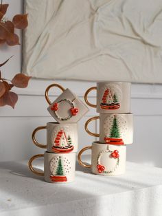 ☕GENERAL FEATURES: Han Home Living pottery tumbler and saucer are made of ceramic material. 24k gold material is used in these christmas tree mugs. These unique ceramic mugs are 100% handmade. This tea mug has a volume of 5 oz (150 ml). These drinking cup are used both for eating and as an object. Also, these unique coffee mugs can be used as toothbrush holders or pen holders. It does not contain chemicals that may affect human health. 🎁A UNIQUE GIFT: Han Home Living coffee mugs are handcrafted Cute Christmas Presents, House Mug, Farmhouse Mugs, Tree Mug, Personalized Christmas Mugs, Mug Crafts, Tea Tumbler, Coffee Cup And Saucer, Living Modern