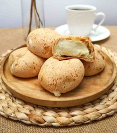 some food is sitting on a wooden plate