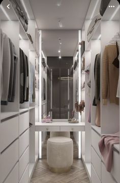 a walk in closet filled with lots of white furniture