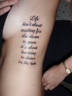 a woman with a tattoo on her arm saying life isn't about waiting for the storm to pass