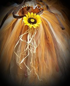 a sunflower is attached to a tutu skirt