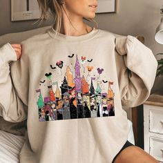 Vintage Disney Princess Halloween Sweatshirt Long Sleeve Character Print T-shirt For Disney Trips, Disney Character Print Long Sleeve Sweatshirt, Disney Long Sleeve Sweatshirt With Character Print, Long Sleeve T-shirt With Character Print For Disney Events, Disney Cartoon Print Sweatshirt For Fan Events, Disney Long Sleeve Tops For Fall, Disney Graphic Print Sweatshirt For Fall, Themed Long Sleeve Tops With Cartoon Print, Themed Long Sleeve Top With Cartoon Print