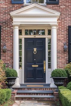 a blue front door with white columns and black shutters on a brick house in washington, dc