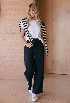 DESCRIPTION Step into the Luxe Straight Leg Ponti Pant, another wardrobe staple by White & Co. These flattering pants boast a modern edge with a sleek, French-inspired black and white stripe tape down the sides. Perfect for the office or weekend outings, they pair beautifully with a crisp white tee and classic blazer for a monochromatic look, or add a pop of colour with a patterned blouse for an effortless transition from day to night. Elevate your casual look by pairing these pants with the Montreal turtleneck and a pair of loafers or create a weekend-ready outfit with a denim jacket and sneakers. Still browsing? Discover our full range of women's clothing. FEATURES & FIT Relaxed straight-leg cut Easy pull on design Elasticated waist Black and white trim tape detailing down the side Side Black With Pops Of Color, 2024 Photoshoot, Flattering Pants, New Street Style, Patterned Blouse, Photoshoot Inspo, Classic Blazer, French Inspired, White Trim