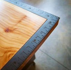 a wooden table with a ruler on it