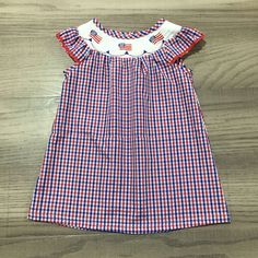 Brand New In Package Polyester Cotton Gingham Smocked Dress With Ruffles, Cotton Smocked Dress With Ruffles For Picnic, Cotton Smocked Dress With Ruffles In Gingham, Gingham Cotton Smocked Dress With Short Sleeves, Plaid Cotton Smocked Dress, Cotton Gingham Dress With Smocked Bodice, Cute Gingham Smocked Dress, Cotton Plaid Dress With Smocked Back, Cute Cotton Smocked Dress In Gingham