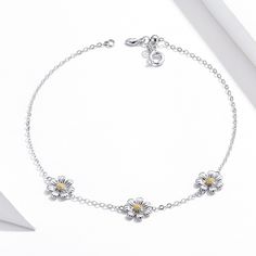 Product Description Celebrate love and happiness with the daisy, a symbol of joy from the universe. This brightly polished sterling silver bracelet features three yellow enameled daisy charms on the top, elegantly placed on a delicate chain station style. A spring ring clasp keeps it secure. Features Material: Sterling Silver, Cubic zirconia Nickel-Free Hyperallergic High-Polish Finish Chain Length: up to 8.66" | 22 cm ( Adjustable ) FAST Shipping from FL, USA Station Bracelet, Daisy Charm, Love And Happiness, Celebrate Love, Delicate Chain, Bracelet Sterling Silver, Sterling Silver Bracelet, Daisy Flower, Jewelry Plate