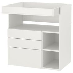 a white shelf with two drawers and one open drawer on the bottom, against a white background