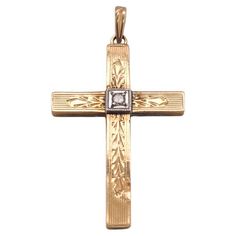 This intricately engraved cross is perfect for the person whose many intricacies you appreciate! A round diamond sits at the center of the cross, shining as bright as the spirit of your recipient, set in white gold and weighing 0.02 carats. This is a beautiful estate piece, ready to be loved again, just as we all deserve to be loved every day. This cross is a great gift to honor commitments, celebrate religious milestones, or remind someone special that they are loved, no matter what. This pendant is made out of 14 karat yellow gold and white gold (stamped "14K"). The cross measures 1 inch long by 3/4 inch wide, and the complete pendant measures just over 1.25 inch long. The details for this intricate cross pendant are listed below: Metal Quality: 14 karats Complete Weight: 1.0 grams Measu Fine Jewelry Crucifix With Diamond Cut, Yellow Gold Diamond Cut Cross Pendant, Deserve To Be Loved, Luxury Diamond-accented Cross Pendant Necklace, Diamond-cut Crucifix Cross Necklace, Yellow Gold Diamond-cut Crucifix Necklace, Engraved Cross, To Be Loved, The Cross