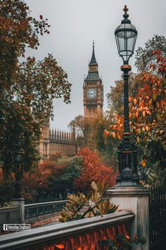 the big ben clock tower towering over the city of london, england in autumn time