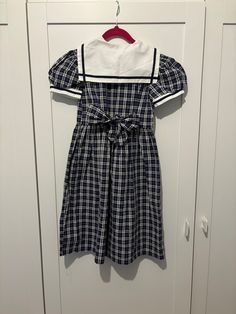 vintage stmichael from marks & spencer's nautical style dress navy & white  sailor collar age 5 years height 43" chest 22" material: 55% cotton, 45% polyester  ties at the back lovely style buttons with a spare button to inside label Collared Spring Dresses For School, Spring School Dress With Collar, Spring School Dress With Peter Pan Collar, Preppy Navy Cotton Dress, Navy Fitted Vintage Dress, Summer Short Sleeve School Uniform Dress, Fitted Short Sleeve School Uniform Dresses, Summer School Uniform Dress With Short Sleeves, Preppy Fitted Collared Dress