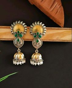 You'll find these Sunflower design jhumka pieces decorated with colorful stones, beads adding even more charm to their rustic beauty. Whether it's a pair of Stud kundan earrings, a necklace, or bracelets, each tells a story of craftsmanship and creativity. Stud Earrings For Women, gift for her,  Designer Navratri Earring,  Indian style Handmade Earrings,  Traditional Jewelry * Main Color : Dark Silver Plated * Skin Friendly : This Product does not contain harmful constituents. Anti-allergic safe Multicolor Earrings For Diwali Rituals, Multicolor Tilla Earrings For Rituals, Fusion Style Jhumkas For Navratri Celebration, Fusion Style Jhumkas For Diwali Celebration, Traditional Multicolor Dual-tone Earrings, Temple Jewelry Cutdana Jhumkas As Gift, Traditional Dual-tone Earrings For Diwali, Fusion Style Jhumkas With Latkans For Gift, Dual-tone Earrings For Navratri Celebration