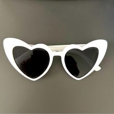 White Plastic Heart-Shaped Sunglasses With Grey Lenses. Never Worn. White Heart-shaped Sunglasses For Valentine's Day, White Heart-shaped Sunglasses With Tinted Lenses, Heart-shaped White Sunglasses With Tinted Lenses, White Heart-shaped Sunglasses For Summer, White Heart-shaped Sunglasses For Beach, Trendy White Sunglasses For Valentine's Day, White Heart-shaped Beach Sunglasses, White Heart Sunglasses, Shaped Sunglasses