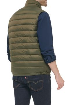 Update your cold-weather collection with this quilted puffer vest that's a versatile must-have layering piece. 26.5" length (Size M) Stand collar Sleeveless Zip front Slanted zipper chest pocket 100% nylon Machine wash cold Imported Model stats: 6'1" height, 32" waist. Model is wearing size M. Casual Nylon Puffer Jacket With Fleece Lining, Casual Nylon Vest With Padded Collar, Quilted Winter Vest For Outdoor, Quilted Winter Outdoor Vest, Quilted Nylon Vest For Fall, Quilted Functional Winter Vest, Quilted Functional Vest For Winter, Functional Quilted Vest For Winter, Functional Quilted Winter Vest