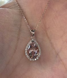 "Beautiful Morganite and Diamond Necklace 14K rose gold pendant. Lays nicely on the neck. Just the perfect size. Genuine pink morganite pear cut 2.80 carats morganite 12x8mm pear morganite Clarity: VS Eye clean stone Genuine earth mined round brilliant cut diamonds 0.38 carats diamonds 18\" 14K Rose Gold necklace Comes with gift box" Luxury Rose Gold Moissanite Necklace, Fine Jewelry Pear-shaped Rose Gold Necklace, Fine Jewelry Rose Gold Pear-shaped Necklace, Rose Gold Pear-shaped Fine Jewelry Necklace, Formal Morganite Teardrop Jewelry, Exquisite Pear-shaped Rose Gold Jewelry, Rose Gold Pear-shaped Gemstone Necklaces, Rose Gold Pear-shaped Gemstone Necklace, Pink Diamond Necklace