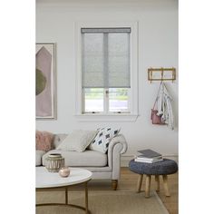 a living room with white walls and furniture