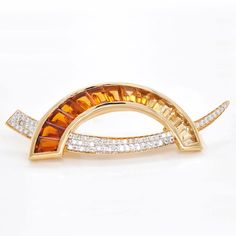 The Signature D-shaped Calibre-Cut Gradient Color Taper Baguette Citrines with Diamonds Brooch Pendant is a remarkable piece of jewelry that seamlessly blends the luxuriousness of 18 karat gold and the brilliance of diamonds. Luxury Yellow Gold Brooches With Gemstones, Luxury Yellow Gold Gemstone Brooches, Luxury Yellow Gold Gemstone Brooch, Luxury Brooches With Diamond Accents, Elegant Orange Brooch Jewelry, Yellow Gold Diamond Gemstone Brooches, Diamond Brooch, Diamond Settings, Stone Cuts