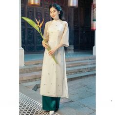 👉 7 DAY REFUND SUPPORT FOR CUSTOMERS IN VIETNAM * Still a Vietnamese girl walking down the street, how beautiful are her innovative ao dai. Selected from the best materials, the 4-piece modern ao dai will bring her the perfect experience. * With a delicate ao dai design in the flower-embroidered sleeves, a little bit of momentum with a stylized side part, this innovative ao dai can turn any girl into a beautiful lady. , young, lovely. * Ao dai in different colors such as pink and beige helps he Ao Dai Design, Vietnamese Dress Ao Dai, Modern Ao Dai, Vietnamese Girl, Girl Walking, Vietnamese Dress, Chiffon Fashion, Matching Pants, Women's Costumes