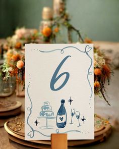 the table is set with an elegant number 6 sign